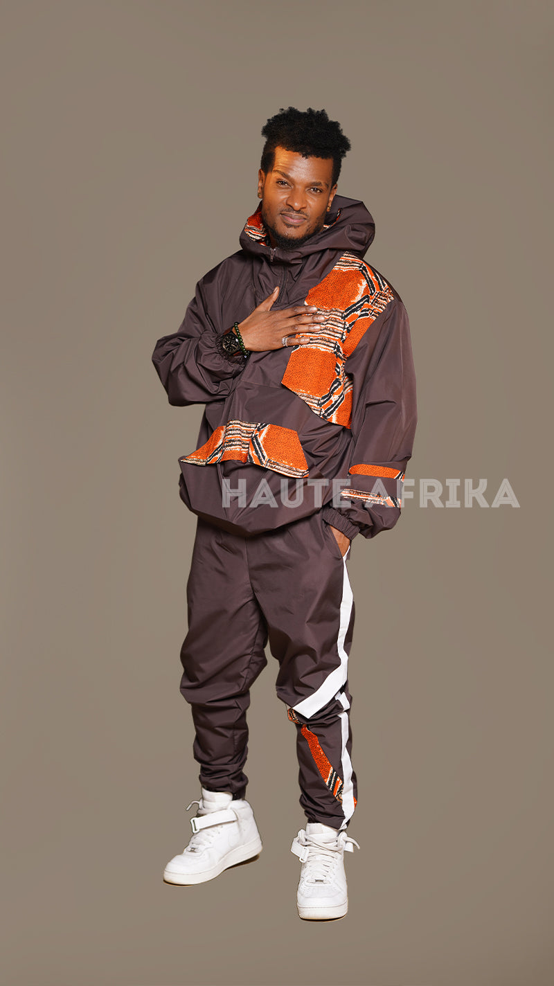 Lusaka Tracksuit colored brown with an orange African print patch