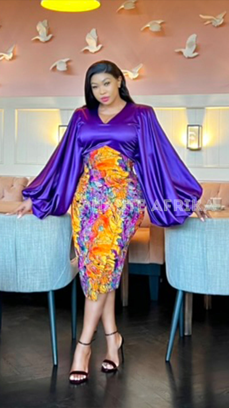 Ayanda 2 Pieace colored purple with a skirt colored red orange and purple mixture African print