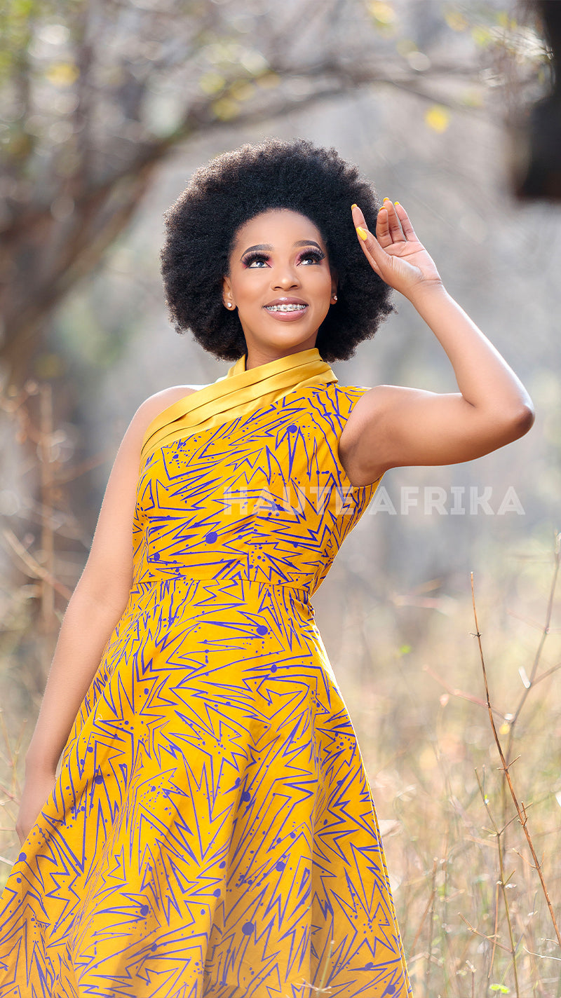 Karoo Dress colored gold yellow with a touch of blue lines and shapes